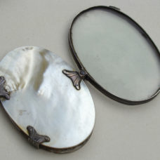 EXCEPTIONAL OVAL MAGNIFIER SET IN SILVER AND MOTHER-OF-PEARL