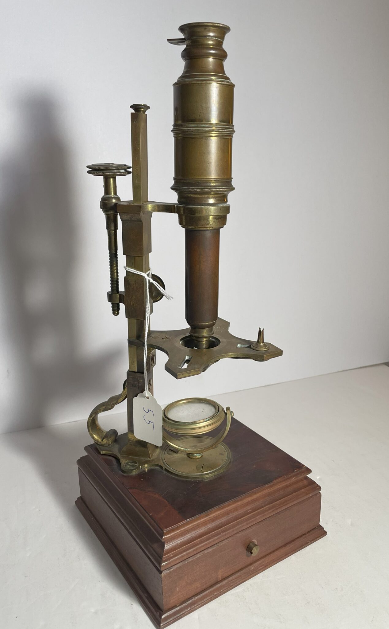 Cuff Style Microscope signed “Dollond London.”