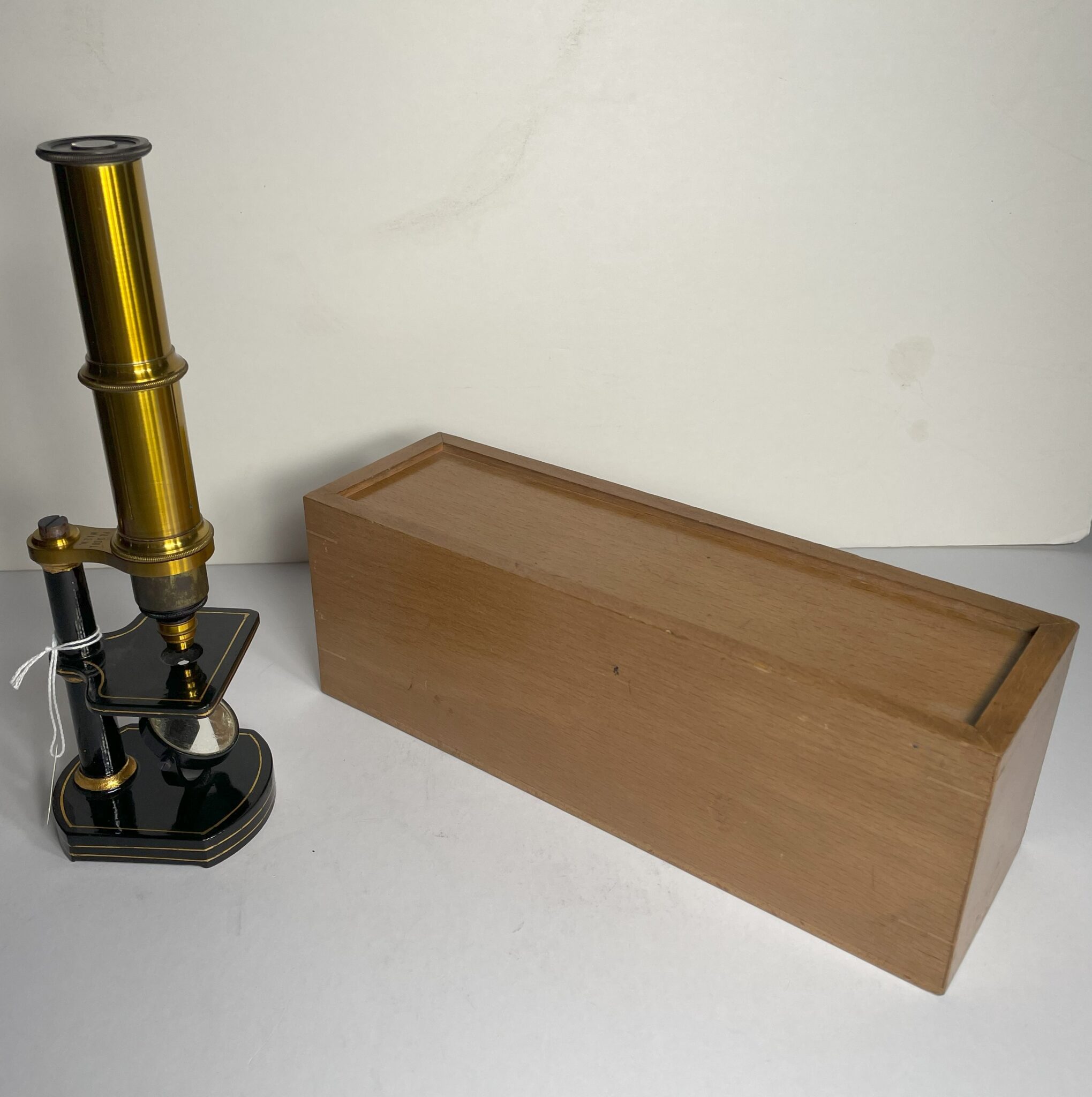 Cased and signed Plossl Microscope.